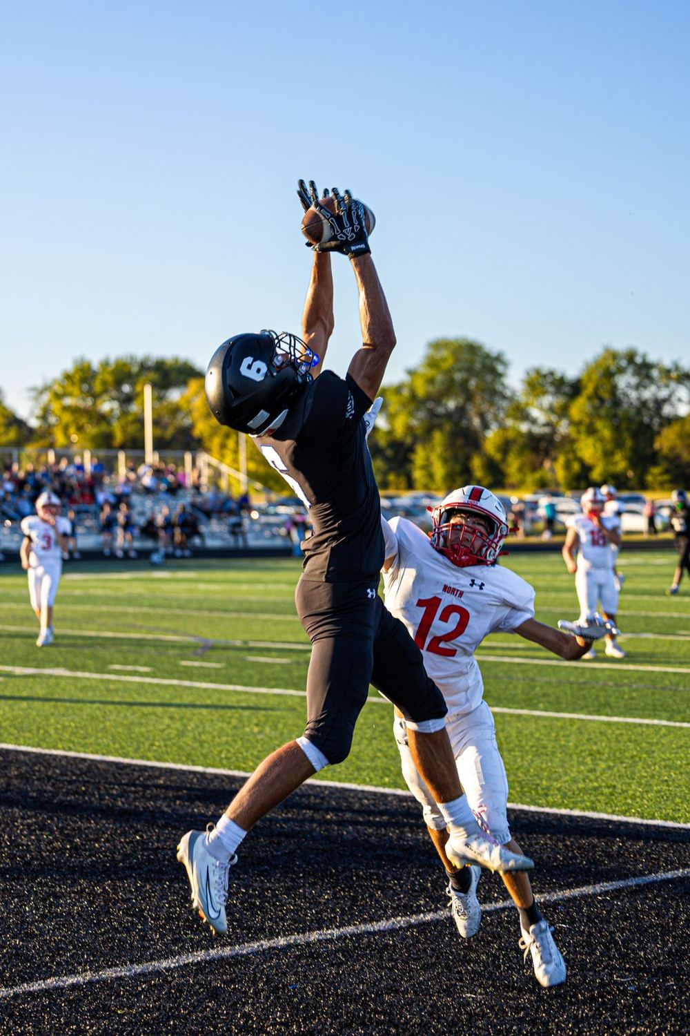 Edje Jackson high-pointing the football for a one-handed catch over a defender in the end zone